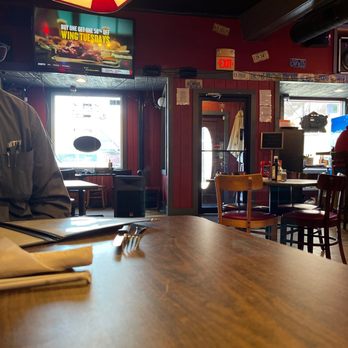 Chasers - a man sitting at a table in a restaurant - New American Near Me - Lebanon, Kentucky Chasers - a man sitting at a table in a restaurant - New American Near Me - Lebanon, Kentucky