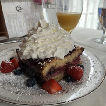 The Mad Hatter - Berry French Toast -layers of French toast, berry filling, creamy sauce and fruit. Yum!!! Just the right sweetness - Tea Rooms Near Me - Anoka, Minnesota The Mad Hatter - Berry French Toast -layers of French toast, berry filling, creamy sauce and fruit. Yum!!! Just the right sweetness - Tea Rooms Near Me - Anoka, Minnesota