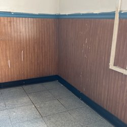 Happy Garden Chinese Restaurant - Old peeling paint, filthy walls, paint that had one point dropped down the wall and was never cleaned off. Is peeling off into the floor.