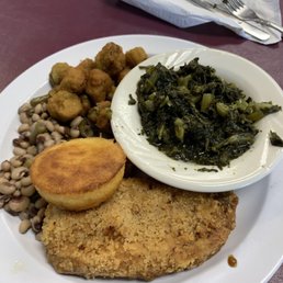 Fried pork chop, field peas, okra, and turnip greens. Fried pork chop, field peas, okra, and turnip greens.