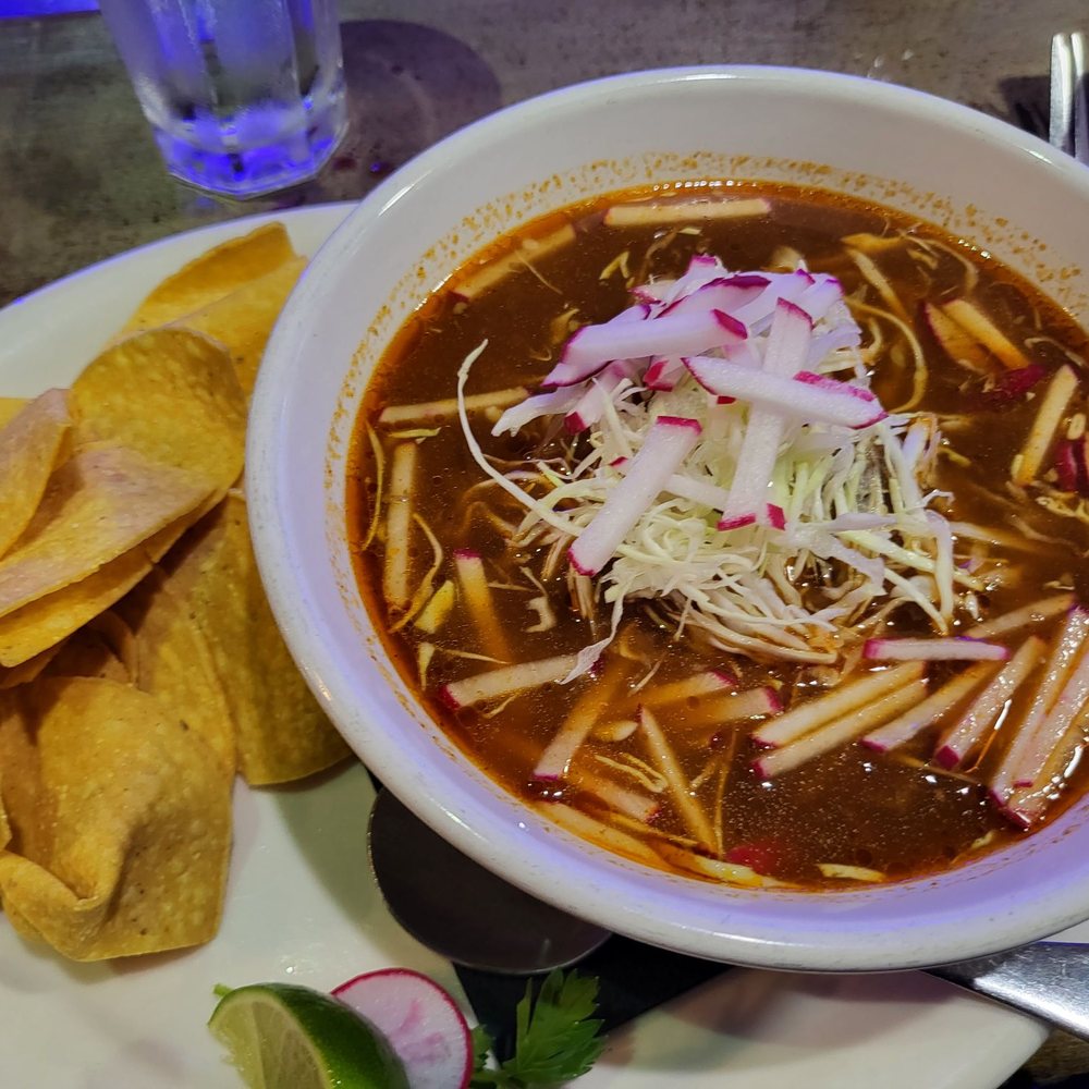 a bowl of soup and chips a bowl of soup and chips