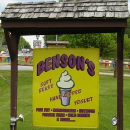 a yellow sign with a cupcake on it