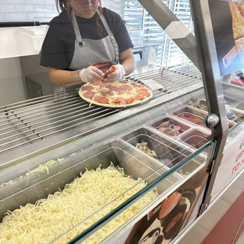 Papa Murphy's - a woman making a pizza - Pizza Near Me - Oklahoma City, Oklahoma Papa Murphy's - a woman making a pizza - Pizza Near Me - Oklahoma City, Oklahoma