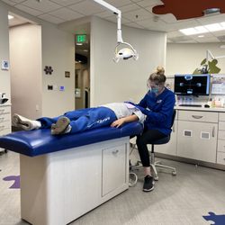 Bay Area Kids Dentist - My 7yo having her teeth cleaned with headphones on watching a movie in the ceiling and sunglasses on !!!!