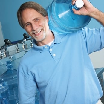 Sunrise Spring Water Company - a man holding a water jug - Water Purification Services Near Me - Newbury, Ohio Sunrise Spring Water Company - a man holding a water jug - Water Purification Services Near Me - Newbury, Ohio
