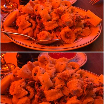 Sergiolino Restaurant - Calamari was delicious! Must get! Lighting in here is neon red/pink. - Pizza Near Me - Laval, Quebec