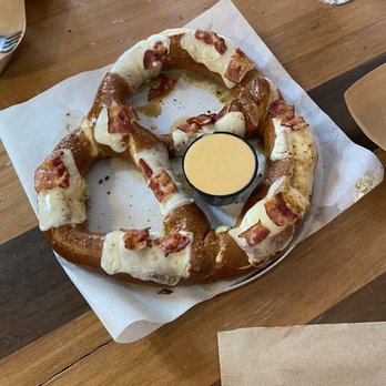 Textile Brewing Company - Bacon Pretzel: baked with butter, Brown Sugar Bourbon seasoning, Swiss cheese, bacon and maple syrup! - Brewpubs Near Me - Dyersville, Iowa Textile Brewing Company - Bacon Pretzel: baked with butter, Brown Sugar Bourbon seasoning, Swiss cheese, bacon and maple syrup! - Brewpubs Near Me - Dyersville, Iowa