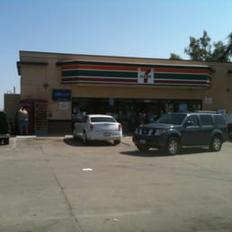 cars parked in front of a convenience store