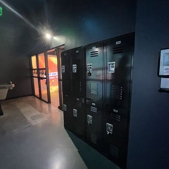 Immersive Gamebox - Lockers if you have bulky items. Otherwise there's a small drink holder in the room. - Arcades Near Me - Alpharetta, Georgia