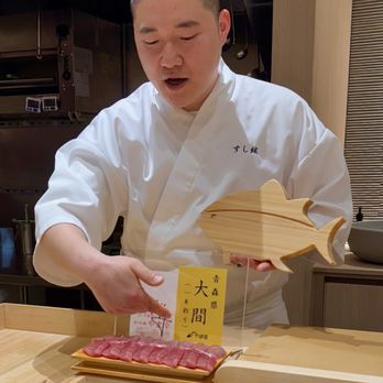 Sushi Hyun - Chef Hyun describing the aged hon maguro (bluefin tuna). The red meat is akami (lean) and the pink meat is chutoro (medium fat). - Sushi Bars Near Me - Vancouver, British Columbia Sushi Hyun - Chef Hyun describing the aged hon maguro (bluefin tuna). The red meat is akami (lean) and the pink meat is chutoro (medium fat). - Sushi Bars Near Me - Vancouver, British Columbia