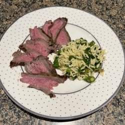 Green Village Packing Co - Your tasty tri tip, oven baked to 120 degrees then broiled to perfect medium rare.  Served with local asparagus orzo salad.