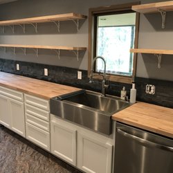 Elite Construction & Remodeling - Full kitchen remodel with butcher block countertops and floating shelves