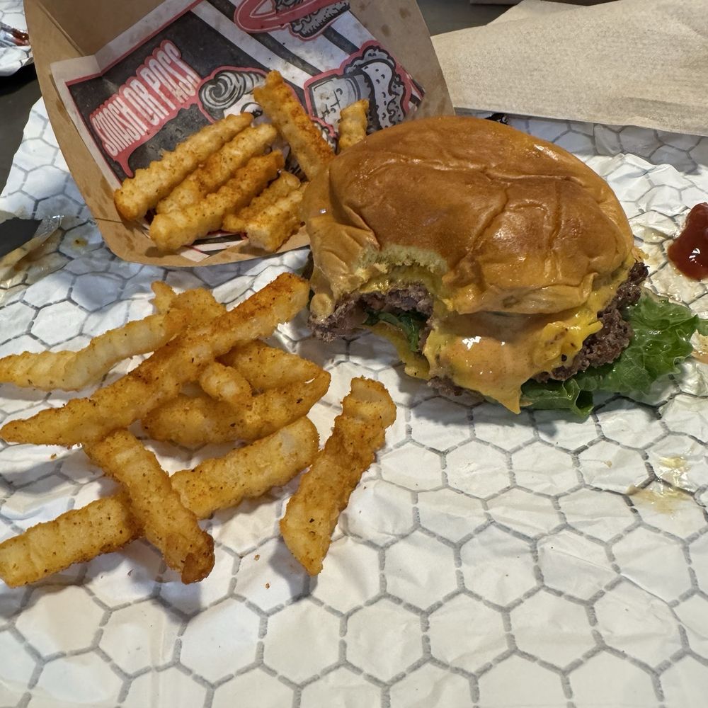 Single, smashed patty with cheese, added lettuce and tomato. And an order of seasoned fries.