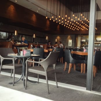 Earls Kitchen + Bar - View from patio looking in. Nice spot on good weather days. - Canadian (New) Near Me - London, Ontario Earls Kitchen + Bar - View from patio looking in. Nice spot on good weather days. - Canadian (New) Near Me - London, Ontario