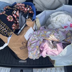 Plato's Closet Lexington - Wadded up designer clothing.