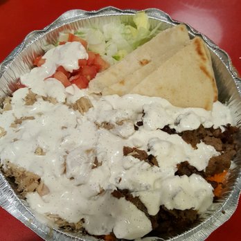 The Halal Guys - Chicken and Gyro Platter with white sauce lettuce and tomatoes - Halal Near Me - Costa Mesa, California The Halal Guys - Chicken and Gyro Platter with white sauce lettuce and tomatoes - Halal Near Me - Costa Mesa, California