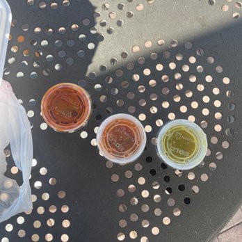 Taco Bar - 3 types of salsas going up in spiciness (green is mild; I can't really tell what the other ones are) - Mexican Near Me - San Marcos, California Taco Bar - 3 types of salsas going up in spiciness (green is mild; I can't really tell what the other ones are) - Mexican Near Me - San Marcos, California