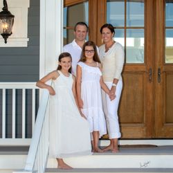 Portraits In The Sand - Family on their front porch of their beach home