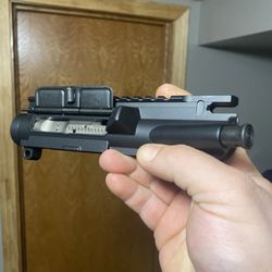 DEGuns Gun Store and Shooting Range - Left handed upper with the stainless bolt carrier.