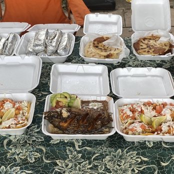 Los Planes De Renderos - a table full of food - Mexican Near Me - El Monte, California