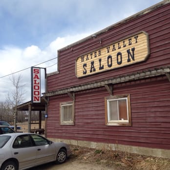 Water Valley Saloon - a car parked in front of the building - Burgers Near Me - Water Valley, Alberta Water Valley Saloon - a car parked in front of the building - Burgers Near Me - Water Valley, Alberta
