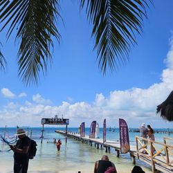 Ice Bar Mexico - small beach play area with hammocks and swing above the water...