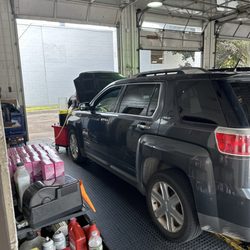 Jiffy Lube - Vehicle getting oil change