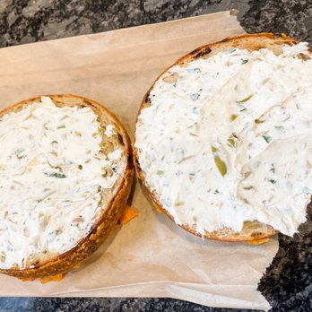 Sidedoor Bagel - a bagel with a spread of cream cheese - Bagels Near Me - Indianapolis, Indiana