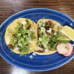 Beef street tacos with cilantro and onion