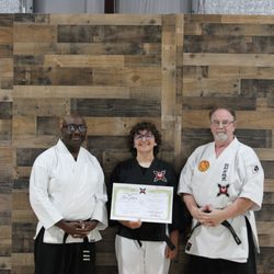 Shinsei Martial Arts & Fitness Center - Student promoted to first Dan in weapons training.