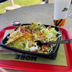 Del Taco - Taco Salad With Fresh Guac Grilled Chicken. Not shown plated, I had already started eating when the Yelp angel whispered to me