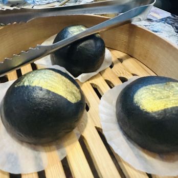 Supreme Dumplings - South Lake Union - Charcoal gold lava custard bun w/ gold flakes - Shanghainese Near Me - Seattle, Washington Supreme Dumplings - South Lake Union - Charcoal gold lava custard bun w/ gold flakes - Shanghainese Near Me - Seattle, Washington