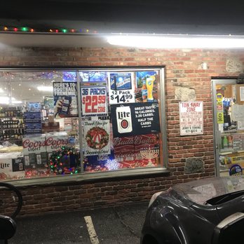 Superstar Beverage - a car parked in front of a store - Beer, Wine & Spirits Near Me - Oyster Bay, New York
