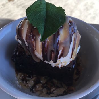 Bridge Seafood - Double fudge brownie with perfectly vanilla ice cream and almond slivers - Seafood Near Me - Anchorage, Alaska Bridge Seafood - Double fudge brownie with perfectly vanilla ice cream and almond slivers - Seafood Near Me - Anchorage, Alaska
