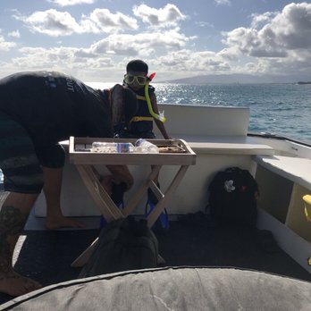 Diamond Head Cruises - Captain helping my youngest when he took a short break. - Snorkeling Near Me - Honolulu, Hawaii Diamond Head Cruises - Captain helping my youngest when he took a short break. - Snorkeling Near Me - Honolulu, Hawaii