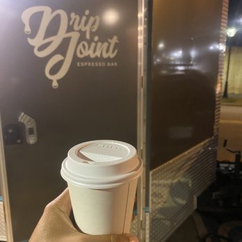 Drip Joint Espresso Bar - a person holding a coffee cup - Food Trucks Near Me - Charlotte, North Carolina