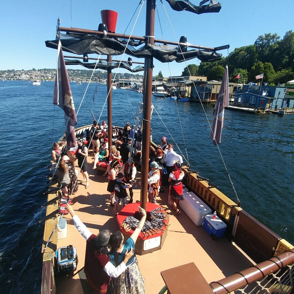 Emerald City Pirates - The view from the captains wheel. Everyone having a blast at Holli's party today. 7/29/17 - Boat Charters Near Me - Seattle, Washington Emerald City Pirates - The view from the captains wheel. Everyone having a blast at Holli's party today. 7/29/17 - Boat Charters Near Me - Seattle, Washington
