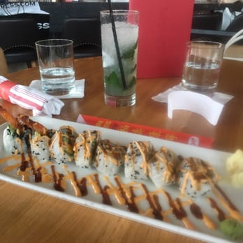 Earls Kitchen + Bar - Dynamite Sushi Roll with a Double Mojito with lime. - New American Near Me - Miami, Florida Earls Kitchen + Bar - Dynamite Sushi Roll with a Double Mojito with lime. - New American Near Me - Miami, Florida