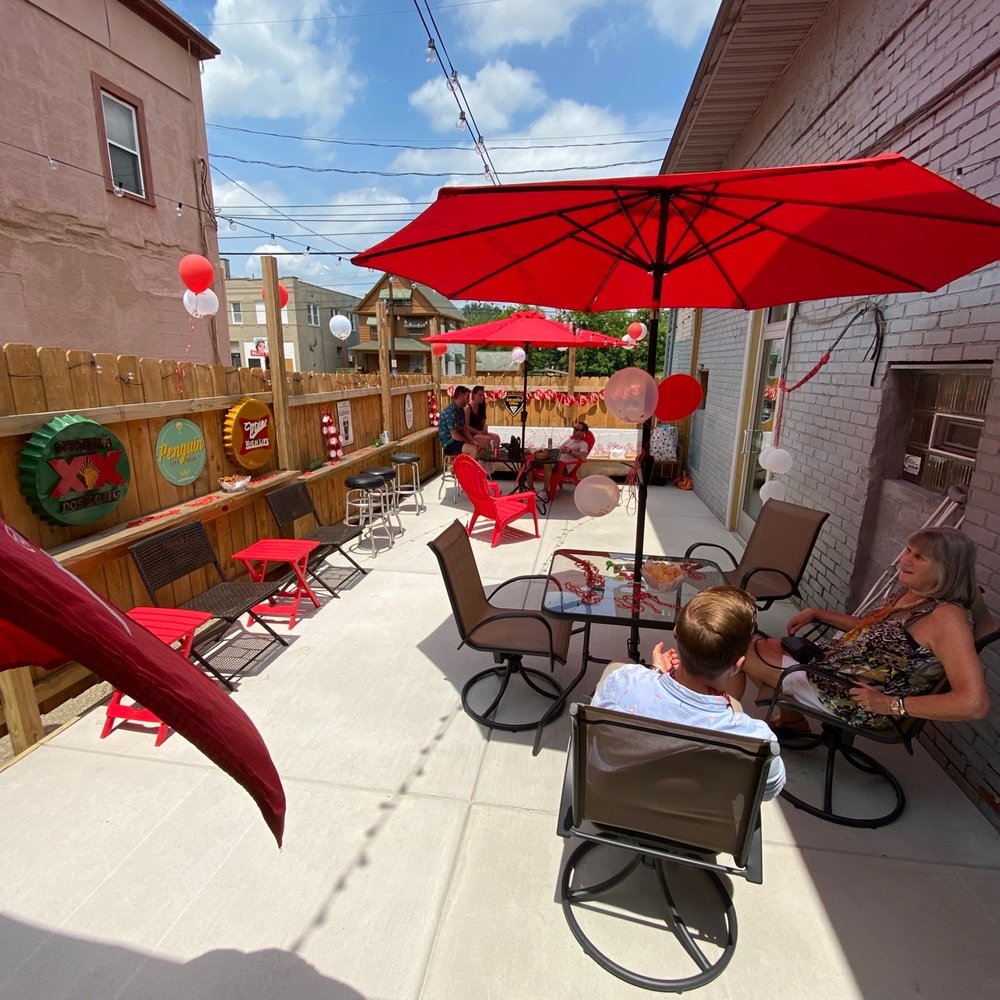 Hackett’s Pub - a patio with chairs and umbrellas - Pubs Near Me - Youngstown, Ohio Hackett’s Pub - a patio with chairs and umbrellas - Pubs Near Me - Youngstown, Ohio