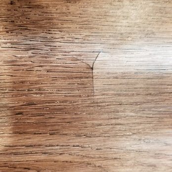 Angel Superior Flooring - This is caused when the installers put the floor board down with something under it. - Flooring Near Me - Austin, Texas