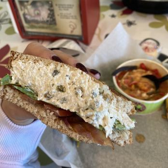 Chicken Salad Chick - a person holding a sandwich - Southern Near Me - Spring, Texas