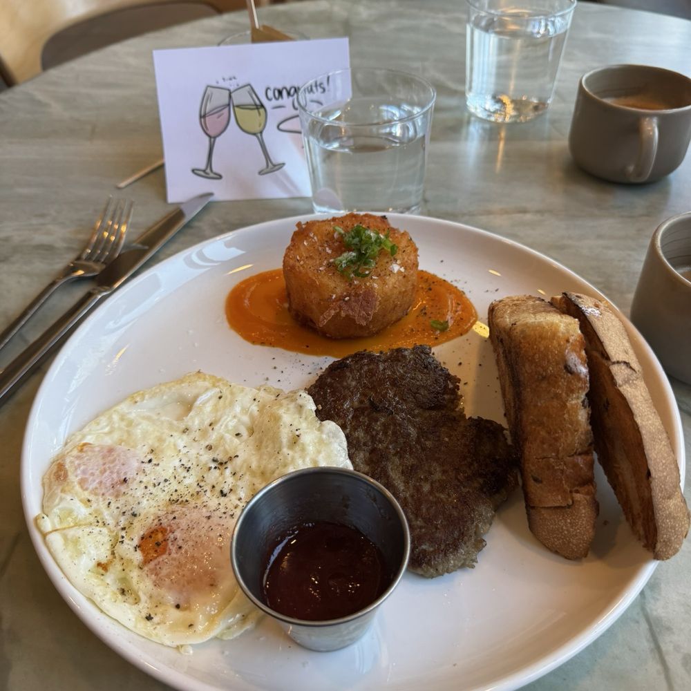 Paperboy Denver - Eggs over easy, buttery toast, sausage patty, cheesy hash browns and jam - Breakfast & Brunch Near Me - Denver, Colorado Paperboy Denver - Eggs over easy, buttery toast, sausage patty, cheesy hash browns and jam - Breakfast & Brunch Near Me - Denver, Colorado