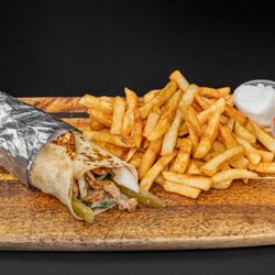 Shawarma Saj - Chicken Shawarma!
Tender slices of chicken topped with garlic sauce.