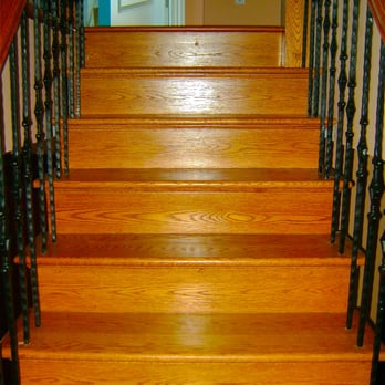Pat's Construction - a close up of a wooden staircase - General Contractors Near Me