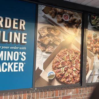 Domino's Pizza - a person walking past a restaurant window - Pizza Near Me - Maitland, Florida Domino's Pizza - a person walking past a restaurant window - Pizza Near Me - Maitland, Florida
