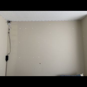 George's Painting Services MA - Before: tape and areas one all with paint ripped off from poorly removed tap and additionally led lights improperly placed near ceiling. - Painters Near Me