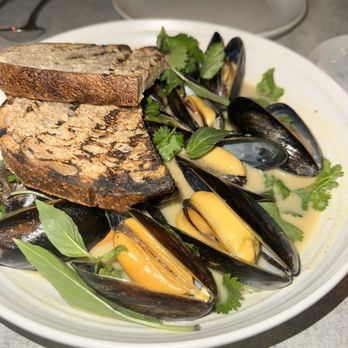 The Fishery - Mussels in green curry with sourdough, delicious mussels and sauce! Ask for two rounds of bread up front - Seafood Markets Near Me - San Diego, California The Fishery - Mussels in green curry with sourdough, delicious mussels and sauce! Ask for two rounds of bread up front - Seafood Markets Near Me - San Diego, California