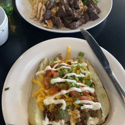 Muscle Maker Grill - Turkey Chili Baked Potato, grilled steak and chicken with brown rice and Side of Steamed Broccoli