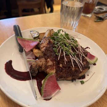 Three Forks Grille - Pork Chop with huckleberry-jalapeño reduction sauce and roasted potatoes - New American Near Me - Columbia Falls, Montana