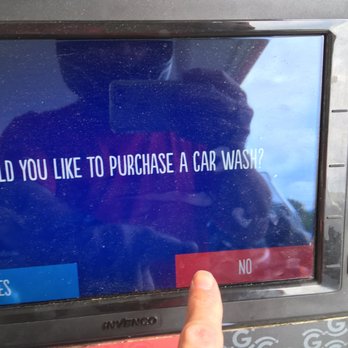 GetGo - a person using a car wash machine - Gas Stations Near Me - Bridgeville, Pennsylvania
